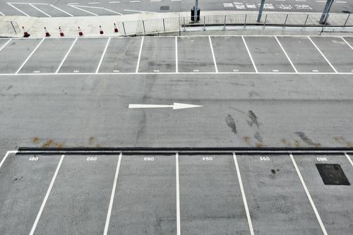 Concrete parking deck with fresh striping and a traffic-rated protective coating