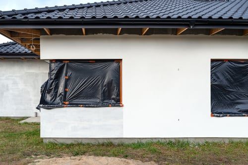 Exterior wall of a home protected with a waterproofing membrane during construction
